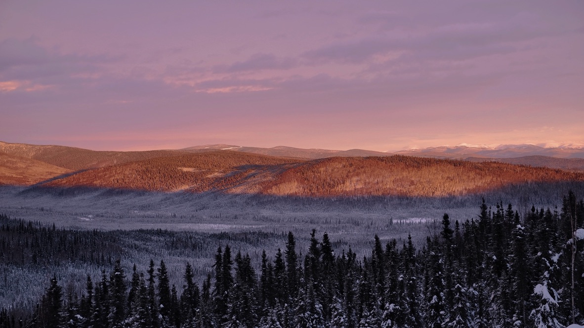 Winter sunset over boreal hills