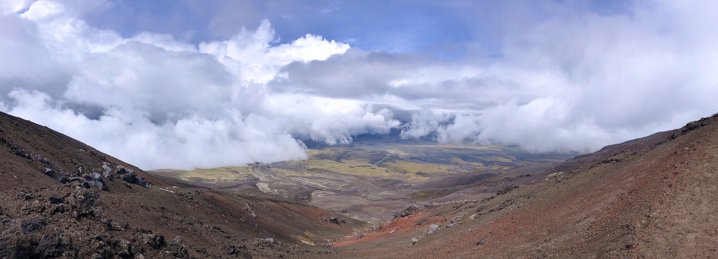Volcano valley under clouds