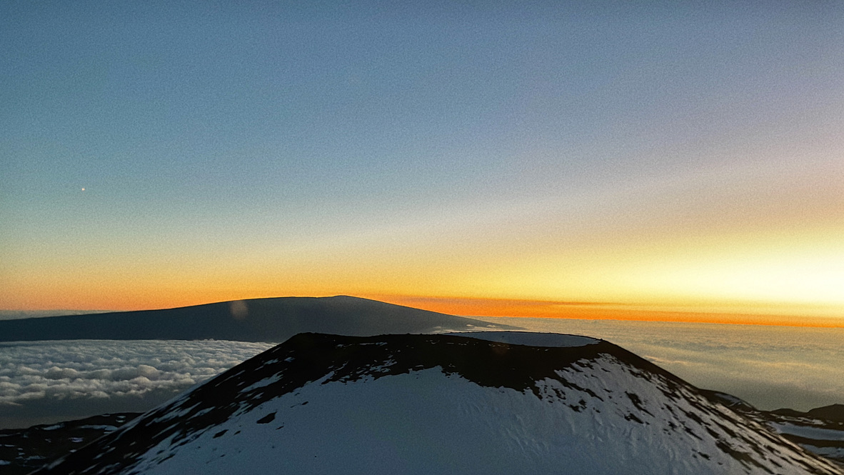 Sunset above the clouds on Mauna Kea